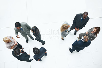 Buy stock photo Meeting, networking and team with business people at airport for conference, communication or event. Corporate seminar, collaboration or discussion with above of employees in lobby for workshop space