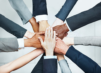 Buy stock photo Above, huddle and hands together in office with business union, diversity or synergy for collaboration. People, teamwork or solidarity in workplace for corporate goals, support or company cooperation