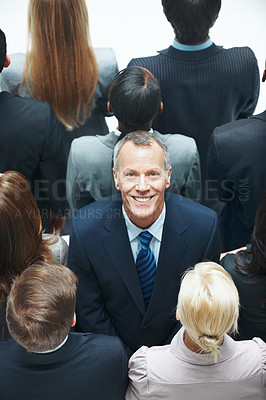 Buy stock photo Portrait, staff and businessman in studio with leadership, pride and happy for corporate career growth. Above, mature person and leader with coworkers, smile and management job on white background.