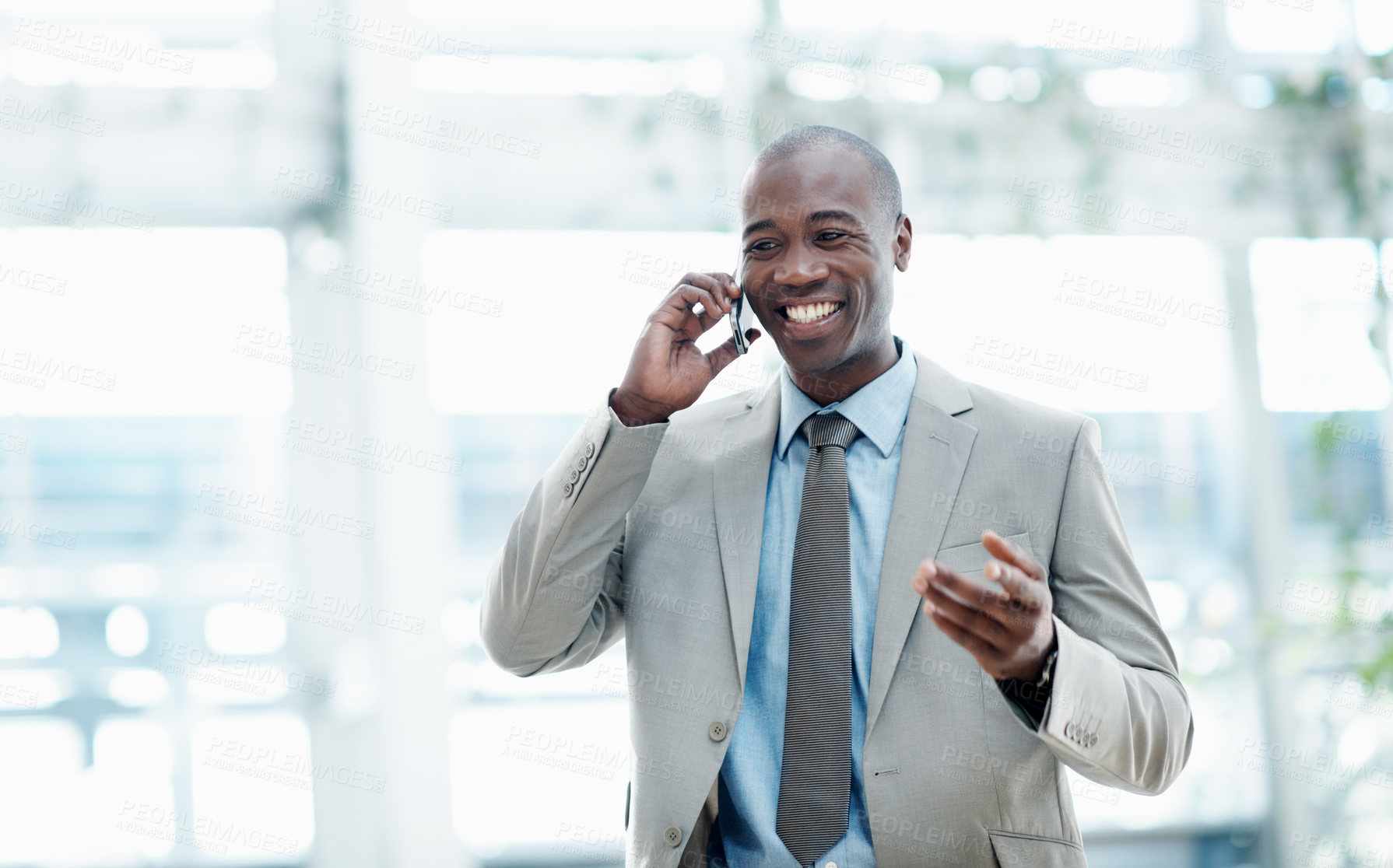 Buy stock photo Lobby, corporate and business man with phone call, discussion and negotiation for investment. Professional, office space and African person on mobile for financial advice,  communication and contact