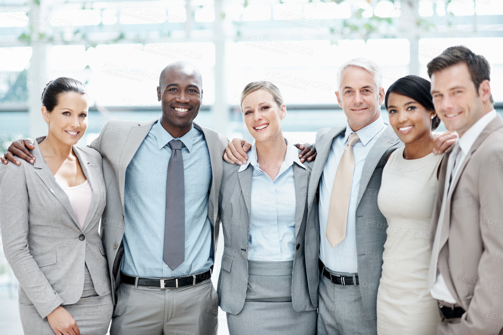 Buy stock photo Corporate, portrait and business people hug in lobby for team, partnership and about us for insurance. Professional, happy and men with woman for company pride, trust and assurance for broker service