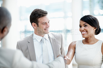Buy stock photo Business, people or smile with handshake in office building for new hire, team welcome or onboarding. Happy intern, employees and shaking hands for first day, career growth and internship opportunity