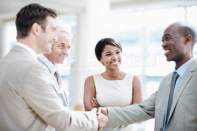 Buy stock photo Team, agreement and handshake with client in office, thank you and happy for investment opportunity. Corporate, investor and shaking hands with business people, collaboration and funding negotiation