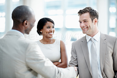 Buy stock photo Smile, handshake and meeting with business people in office for contract, deal and thank you. Partnership, shaking hands and welcome with employees in agency for team, support and opportunity