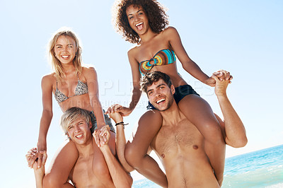 Buy stock photo Shoulders, carry and portrait of friends at beach for summer vacation, holiday and playful on weekend. Happy, laugh and men with women for fun, support and bonding by ocean for travel, trip and relax