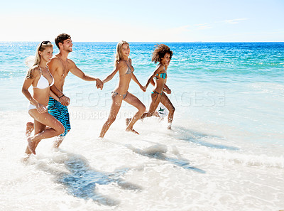 Buy stock photo Holding hands, running and sea with friends at beach for summer vacation, support and travel. Tropical getaway, connection and adventure with people in ocean for tourism, portrait and bonding
