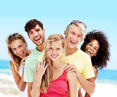 Buy stock photo Joke, portrait and travel with friends at beach for summer vacation, bonding or smile together. Tropical getaway, tourism and weekend break with group of people laughing  outdoor for social gathering