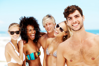 Buy stock photo Travel, friends and portrait of man at beach for bonding, summer vacation and adventure. Tropical holiday, tourism and paradise with group of people outdoor for social gathering, gen z and getaway