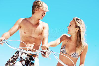 Buy stock photo Cycling, happy and date with couple at beach for love, summer vacation and bonding. Travel, support and adventure with man and woman on bicycle outdoor for journey, freedom and smile together