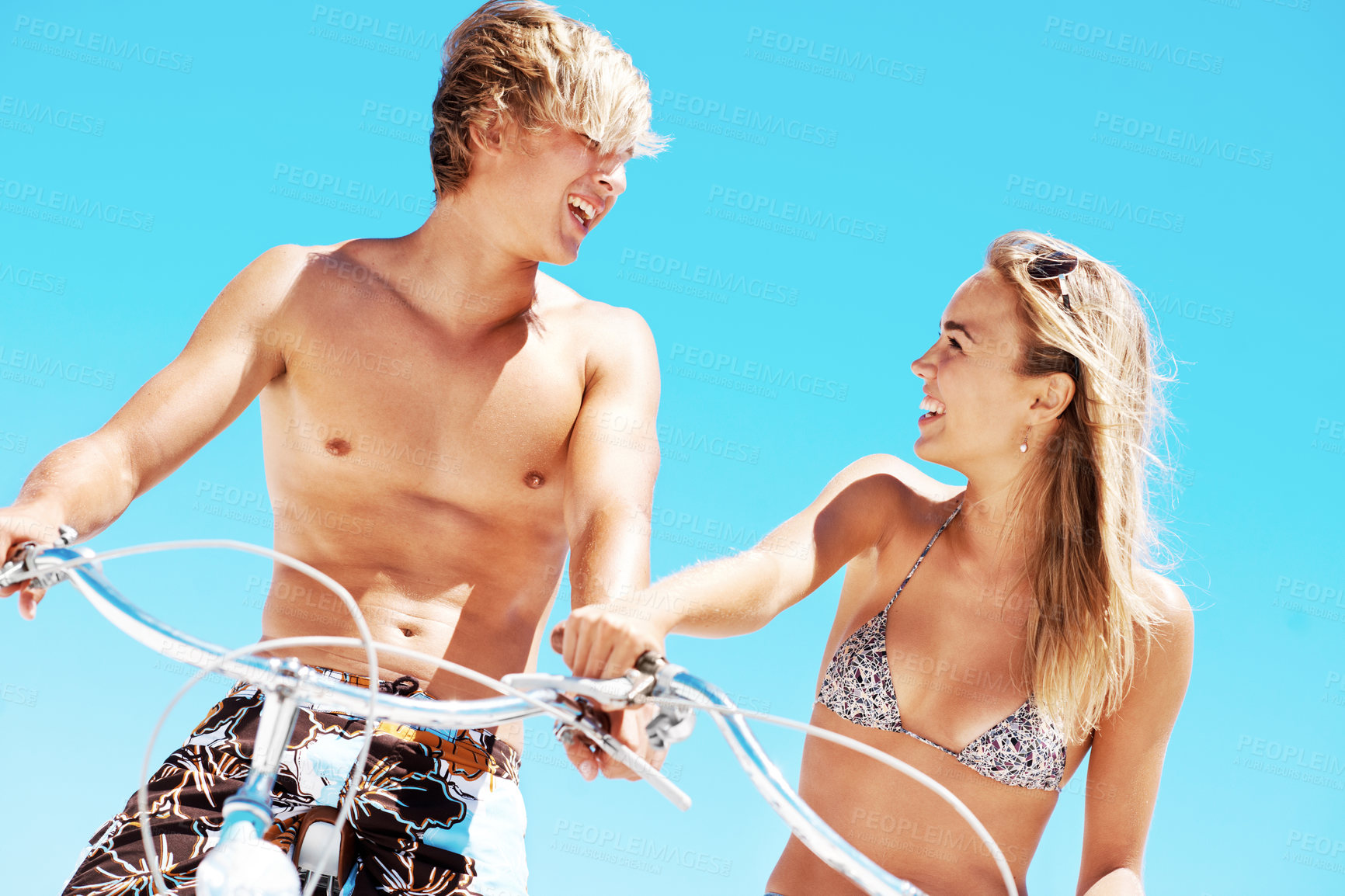 Buy stock photo Cycling, happy and date with couple at beach for love, summer vacation and bonding. Travel, support and adventure with man and woman on bicycle outdoor for journey, freedom and smile together