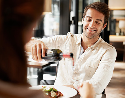 Buy stock photo Man, date and red wine at restaurant while happy with love, care and commitment to partner. Couple, food and drinking to romantic connection, anniversary or dining with smile in relationship
