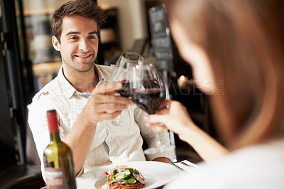 Buy stock photo Man, couple and cheers in restaurant with wine, anniversary date or connection for bonding together. Happy people, romantic relationship and toast at table with alcohol beverage, celebration or love.