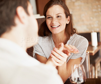 Buy stock photo Love, woman or couple in restaurant with holding hands, partner loyalty and happy moment with bonding. Smile, trust and people with affection, caring relationship or connection in romantic date.
