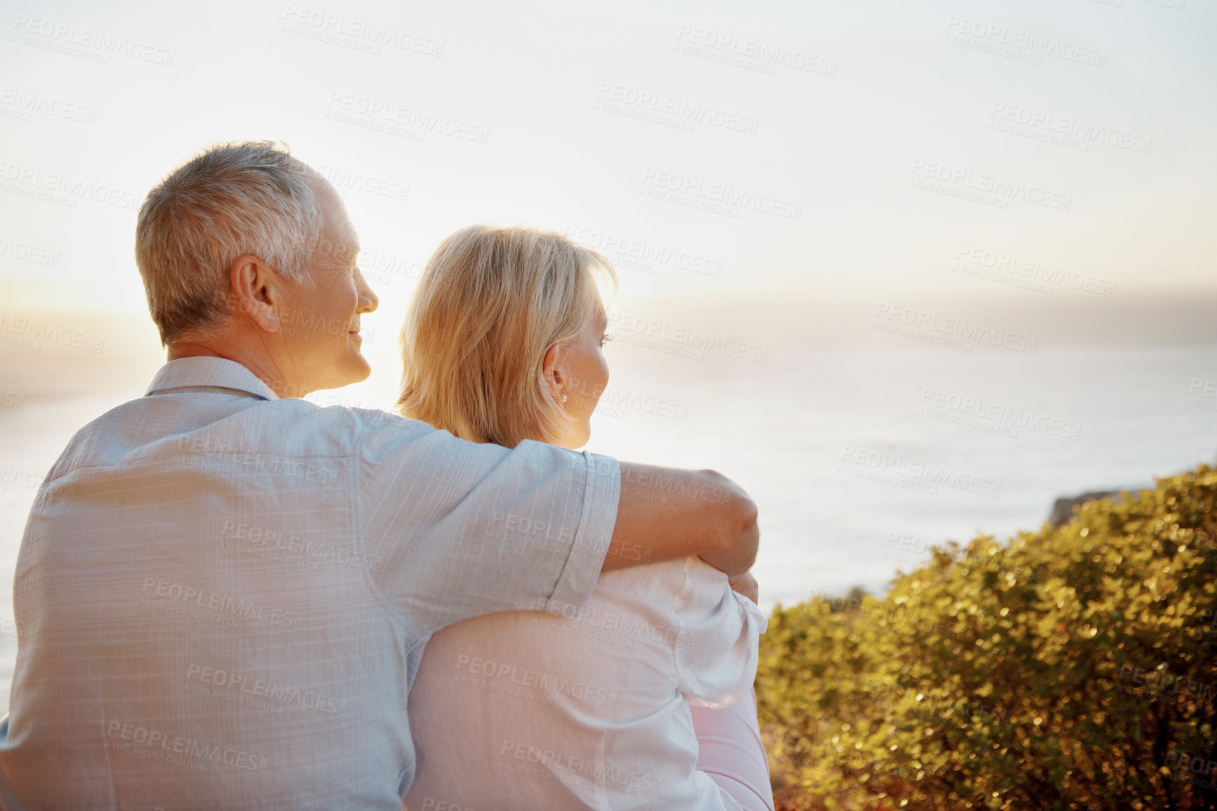 Buy stock photo Senior couple, sightseeing and hug in nature, romance and bonding with partner on vacation and break. Outdoor, space and old people with smile on holiday, back and connection with spouse or affection