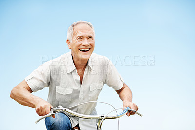 Buy stock photo Smile, senior man and fitness with bicycle outdoor for wellness, eco friendly transport and space. Happy, elderly person and cycling with countryside trip, travel and mockup for retirement exercise