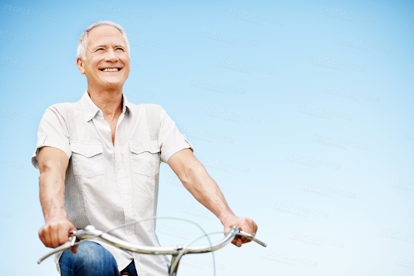 Buy stock photo Happy, senior man and fitness with bicycle outdoor for wellness, eco friendly transport and space. Smile, elderly person and cycling with countryside trip, travel and mockup for retirement exercise
