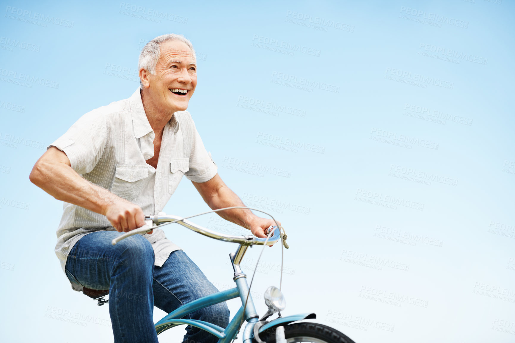 Buy stock photo Excited, senior man and fitness with bicycle outdoor for wellness, eco friendly transport and space. Happy, elderly person and cycling with countryside trip, travel and mockup for retirement exercise