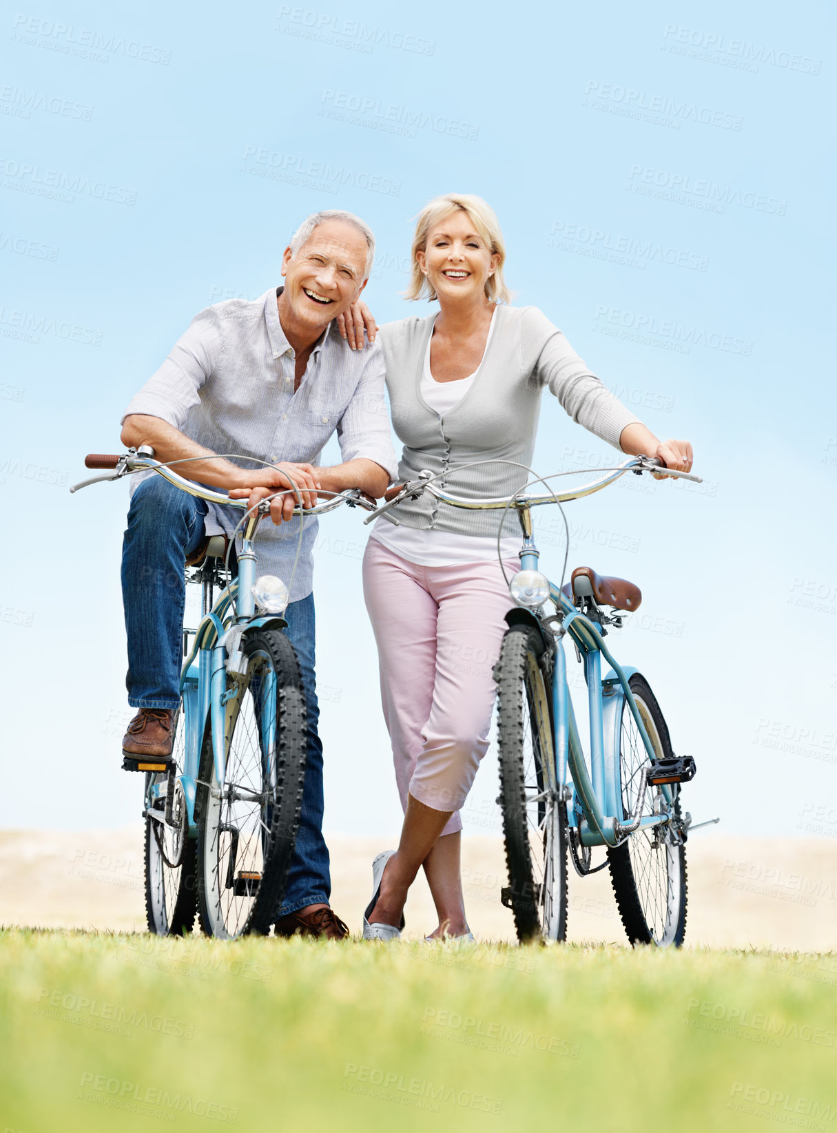 Buy stock photo Portrait, cycling and smile with old couple in nature for bonding, weekend break and anniversary vacation. Retirement, holiday and travel with senior man and woman on bicycle outdoor for marriage