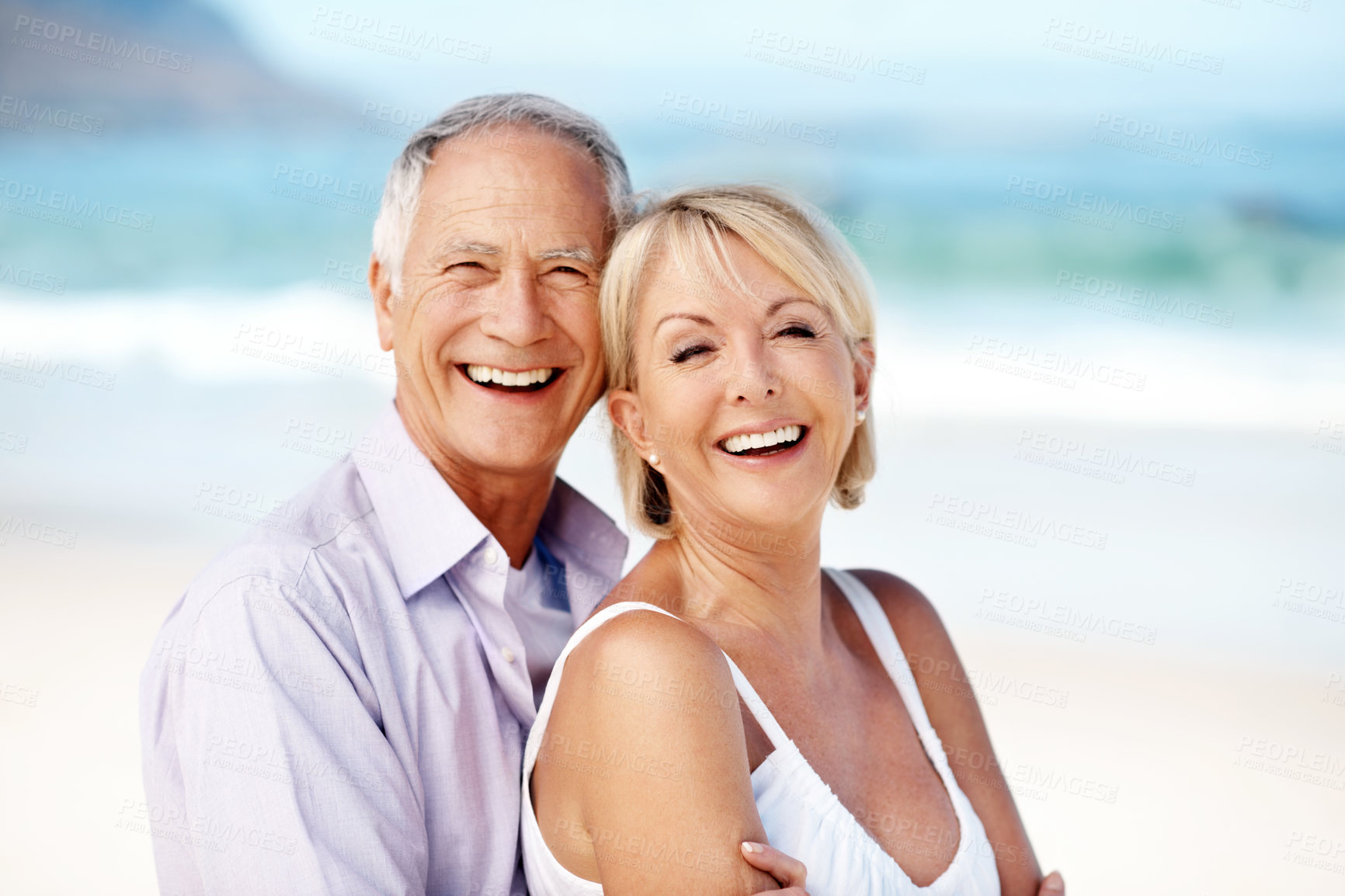 Buy stock photo Portrait, hug and mature couple at beach with happiness for marriage, relationship and holiday together. Embrace, travel and man with woman by ocean for summer vacation, weekend and bonding for love