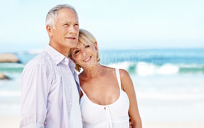 Buy stock photo Happy, hug and mature couple at beach with affection for marriage, relationship and holiday together. Smile, travel and man with woman by ocean for summer vacation, weekend and embrace for bonding