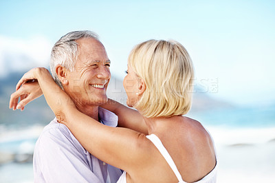 Buy stock photo Hug, space and couple by beach on holiday, getaway or weekend trip together for bonding. Happy, love and mature woman embracing man by ocean for connection, commitment or care in marriage on vacation