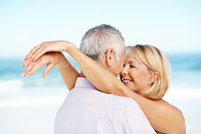 Buy stock photo Holiday, love or elderly couple at beach with embrace, happy moment or connection on trip. Trust, smile or senior people with forehead touch, romantic relationship or bonding on outdoor getaway.