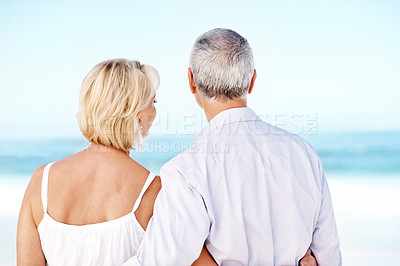 Buy stock photo Back, hug and mature couple at beach with summer holiday, connection and bonding for romantic getaway. Married people, embrace and relax outdoor by ocean with love, vacation and trip for anniversary.