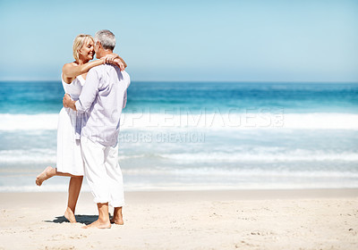 Buy stock photo Holiday, smile or elderly couple at beach with hug, bonding together or connection on summer trip. Love, space or senior people with embrace, romantic relationship or happy moment on outdoor getaway.