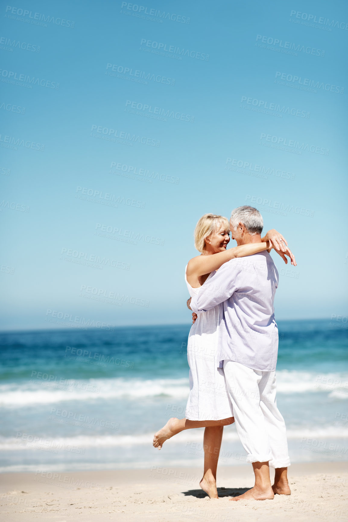 Buy stock photo Holiday, smile or elderly couple at beach with embrace, happy moment or connection on summer trip. Space, love or senior people with hug, romantic relationship or bonding together on outdoor getaway.