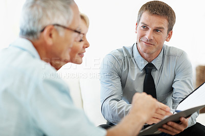 Buy stock photo Smile, consulting and financial advisor with old couple for retirement plan, wealth management and profit. Insurance payout, budget and broker with senior man and woman in home for joint account