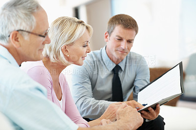 Buy stock photo Old couple, document or consulting with financial advisor in home, investment planning or pension. People, wealth consultant or paperwork at house for annuity, asset management or retirement savings
