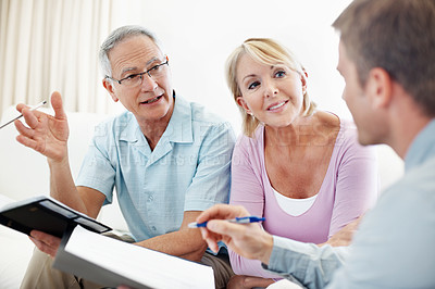 Buy stock photo Talking, advice and financial advisor with old couple in home for retirement plan, wealth management and profit. Insurance payout, budget and broker with senior man and woman for joint account