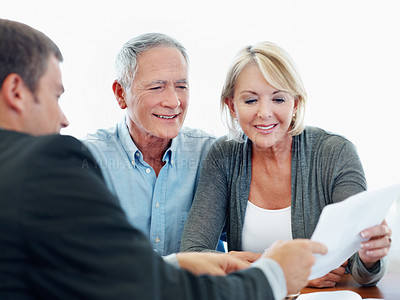 Buy stock photo Senior couple, talk and financial advisor with paperwork, happy or listening to retirement strategy. Old people, meeting and estate planning with wealth manager, explaining and advice with documents
