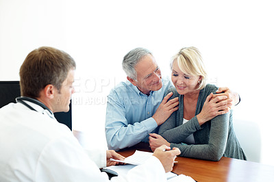 Buy stock photo Hospital, good news and mature couple with doctor for medical service, health results and check up. Healthcare, embrace and people with consultant for diagnosis, treatment and wellness with paperwork