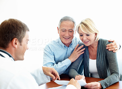 Buy stock photo Healthcare, doctor and elderly couple in office for consultation, insurance policy update or survey discussion. Man, old people or report in clinic for assessment, support or medical history meeting