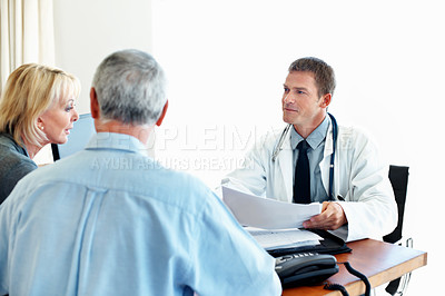Buy stock photo Doctor, notes and consultation with elderly couple, healthcare or patient history on white background. Medical worker, people and talking in clinic office with paper, retirement or diagnosis results