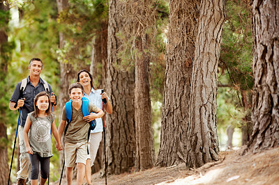 Buy stock photo Hiking, trees and portrait of family outdoor for adventure, exploring or bonding on holiday. Happy, backpacking and parents with children in forest for trekking on vacation, getaway or weekend trip.