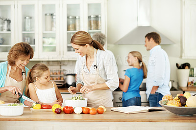 Buy stock photo Big family, cooking and bonding with child in kitchen, growth and learning culinary skills in house. Teaching, kid and meal prep with grandma, generations and happy people with recipe in apartment