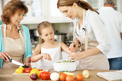 Buy stock photo Cooking, grandmother and girl with mom in kitchen for learning, culinary lesson and help with lunch. Home, generations and happy child with ingredients, vegetables and healthy dinner with family