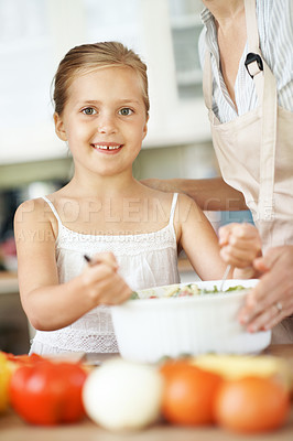 Buy stock photo Cooking, parent and happy child with salad in home for help, support and teaching family recipe. Meal prep, people and kid learning in portrait for culinary skills, healthy food and bonding activity