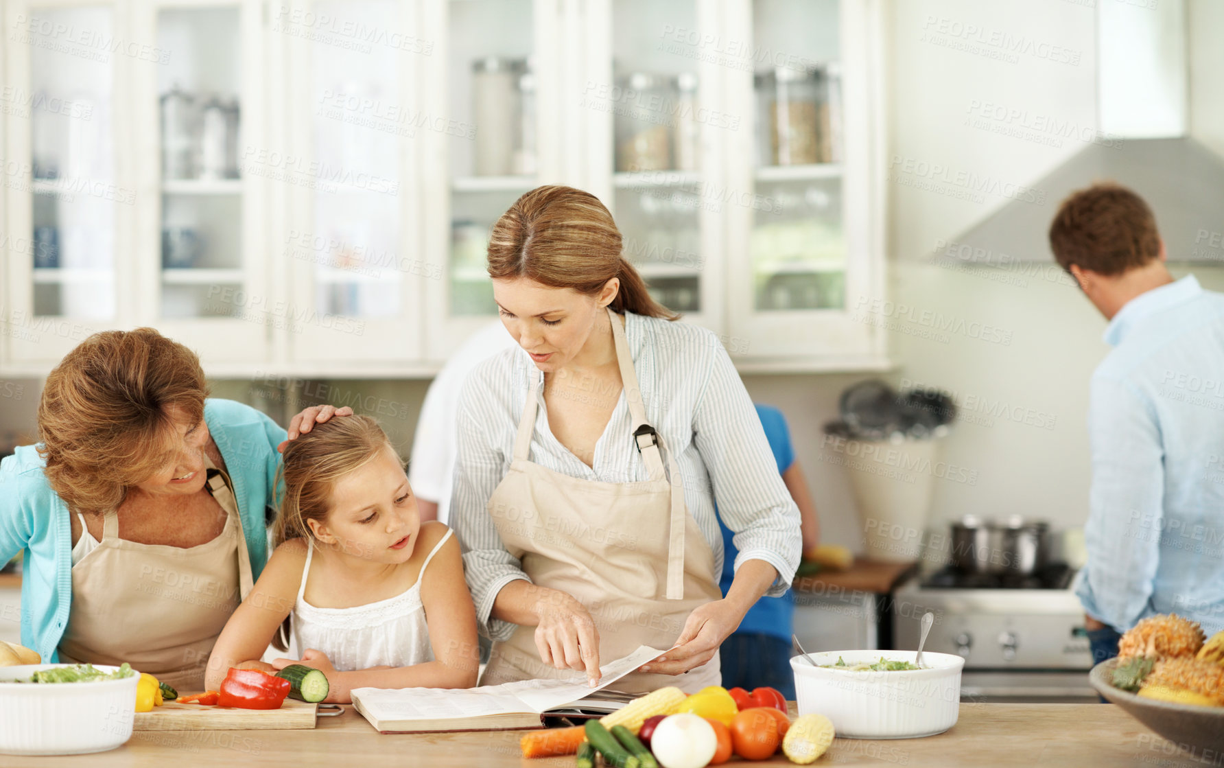 Buy stock photo Family, cooking and child in kitchen with book for recipe, culinary skills and ingredients for lunch. Generations, home and girl with mom, grandma and learning for help with dinner and meal prep 