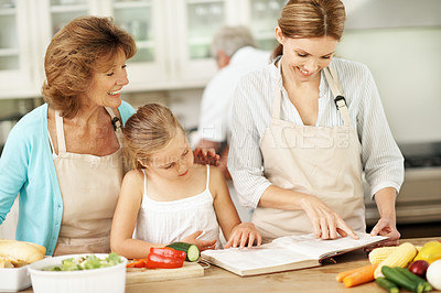 Buy stock photo Recipe, cooking and children in kitchen with book for ideas, culinary skills and ingredients for lunch. Generations, home and girl with mom, grandma and learning for help with dinner and meal prep 