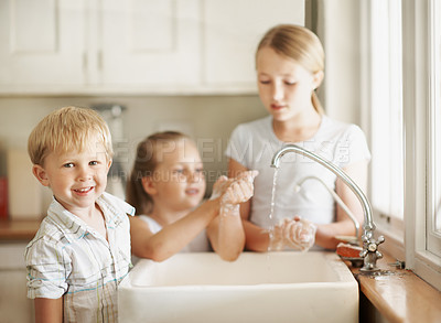 Buy stock photo Happy, portrait and boy in bathroom and washing hands for hygiene, wellness and cleaning with siblings. Smile, family and children by sink for soap, foam and disinfection for germ prevention in home