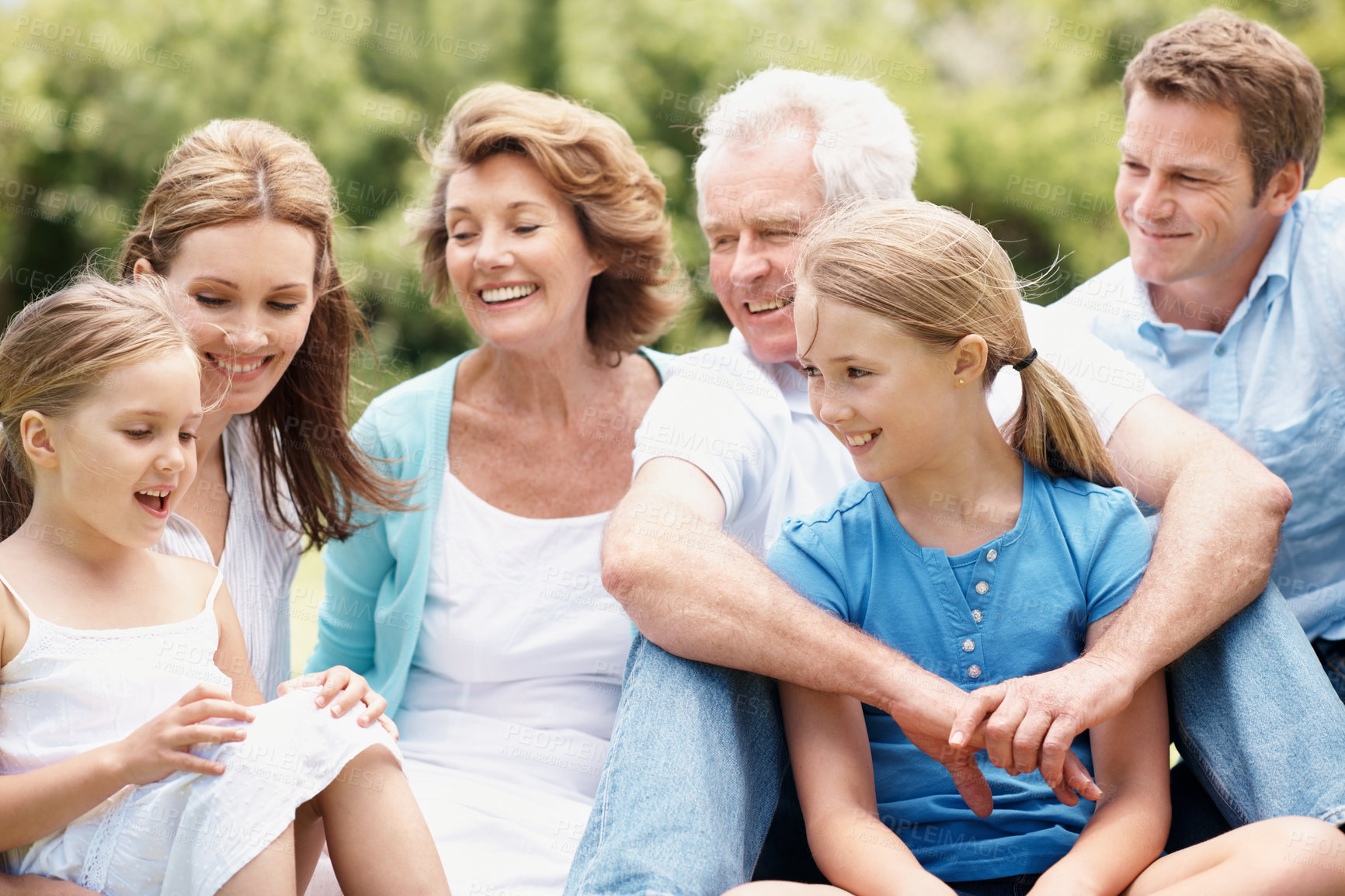 Buy stock photo Grandparents, parents and kids outdoor with laugh, generations together and funny joke for bonding. Happy family, senior people and children relax with humor for connection, good mood and wellness.