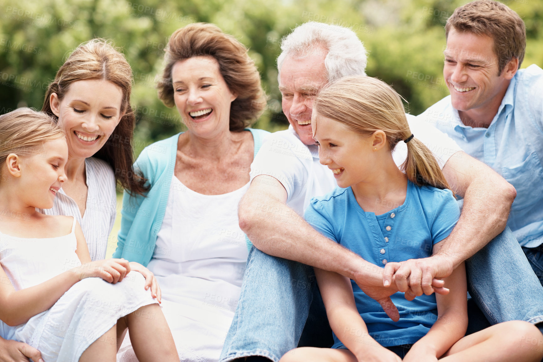 Buy stock photo Grandparents, parents and children outdoor with laugh, generations together and funny joke for bonding. Happy family, senior people and kids in park with humor for connection, good mood and wellness.