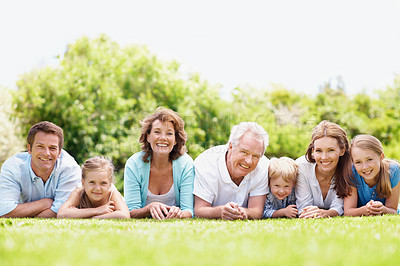 Buy stock photo Family, generations and bonding with children on grass, happy and reunion with grandparents on break. Outdoor, senior people and parents with kids on weekend, portrait and relax with smile in nature