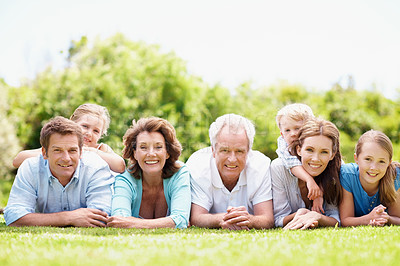 Buy stock photo Portrait, family and parents outdoor with children, relax together or generations bonding on weekend. Happy, mature people and grandma on grass with grandfather, kids chill and rest for wellness.