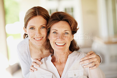 Buy stock photo Hug, portrait and happy with senior mother and woman in home for bonding, support and love. Family visit, connection and smile with people in house for weekend break, care and embrace together