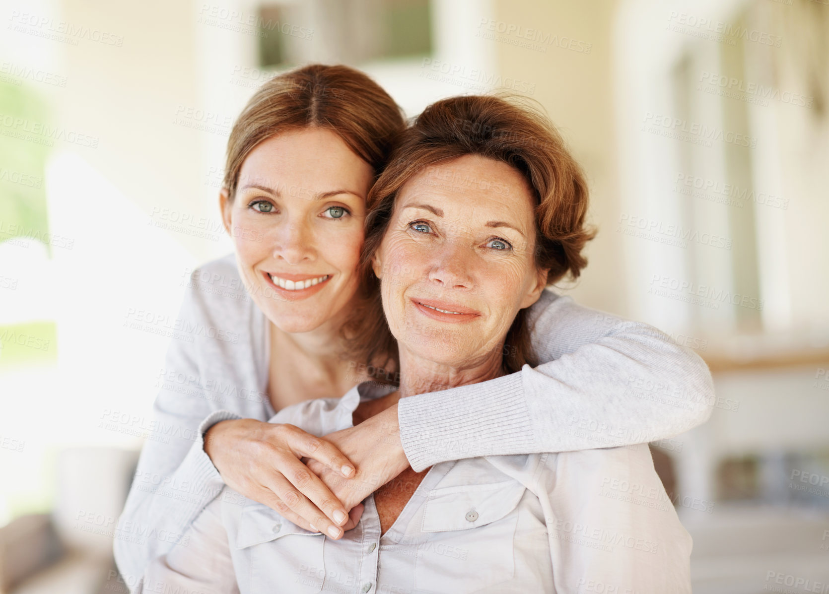 Buy stock photo Hug, portrait and relax with senior mother and woman in home for bonding, support and love. Family visit, connection and happy with people in house for weekend break, care and embrace together
