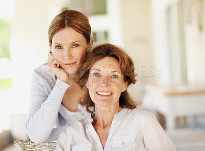 Buy stock photo Hug, portrait and support with senior mother and woman in home for bonding, smile and love. Family visit, connection and happy with people in house for weekend break, care and embrace together
